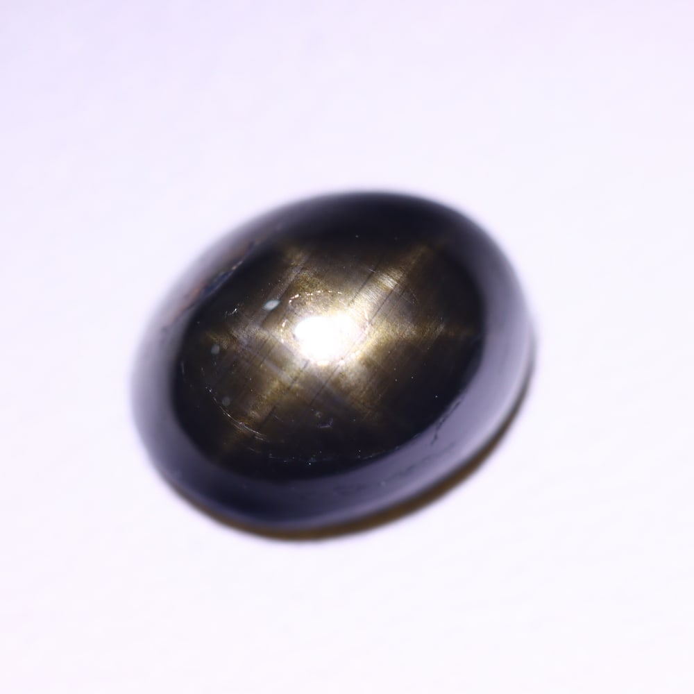 2.98cts 6 Rays Black Star Sapphire , 384E: Ksmith Heritage Auctioneers Subject: Natural 6 Rays Star Sapphire Origin: Myanmar Carat Weight: 2.98 cts Dimension: 8.8x6.7x4.1 mm Treatment: Diffusion Type: Cabochon, Pol