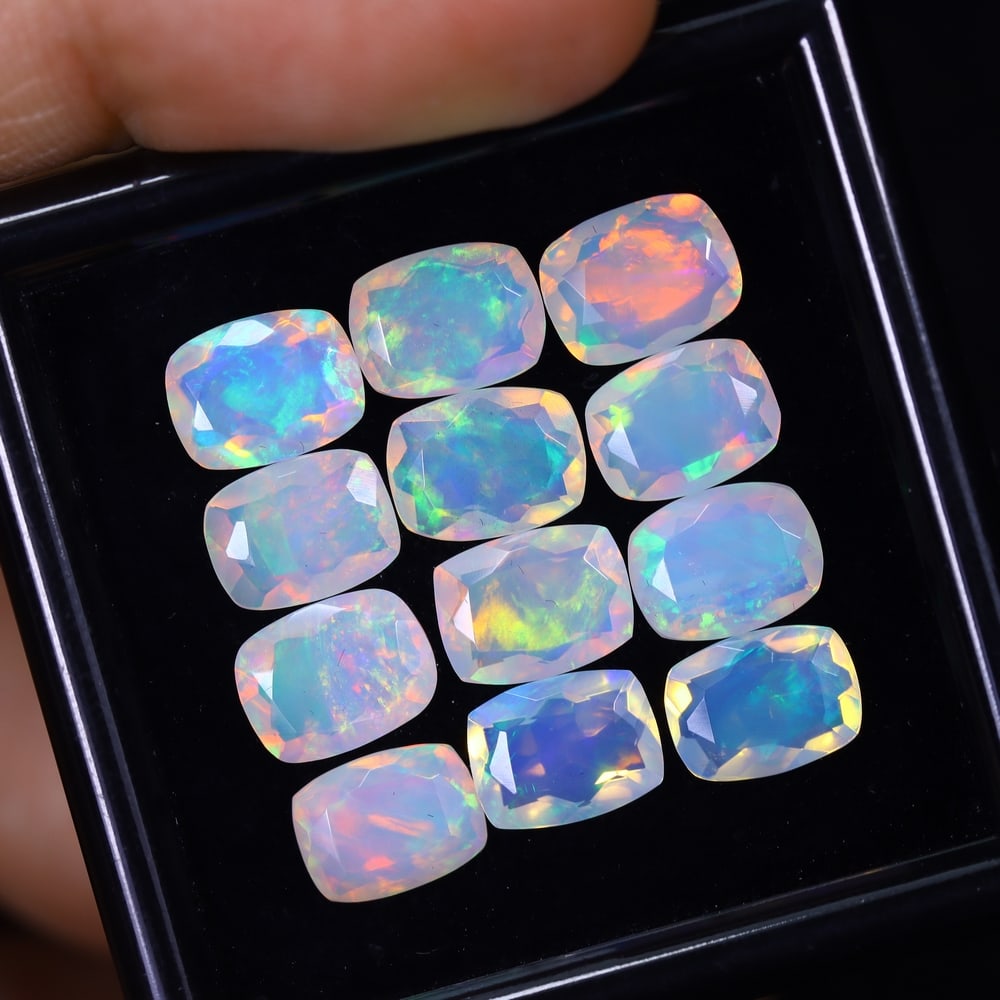 *10.58Ct 12pcs Calibrated 8x6mm Faceted Welo Opal Set - Ethiopian Opal, 126B: Ksmith Heritage Auctioneers Subject: Natural Ethiopian Welo Opal Origin: Ethiopia Carat Weight: 10.58Ct Treatment: Natural Untreated Type: Faceted, Polished