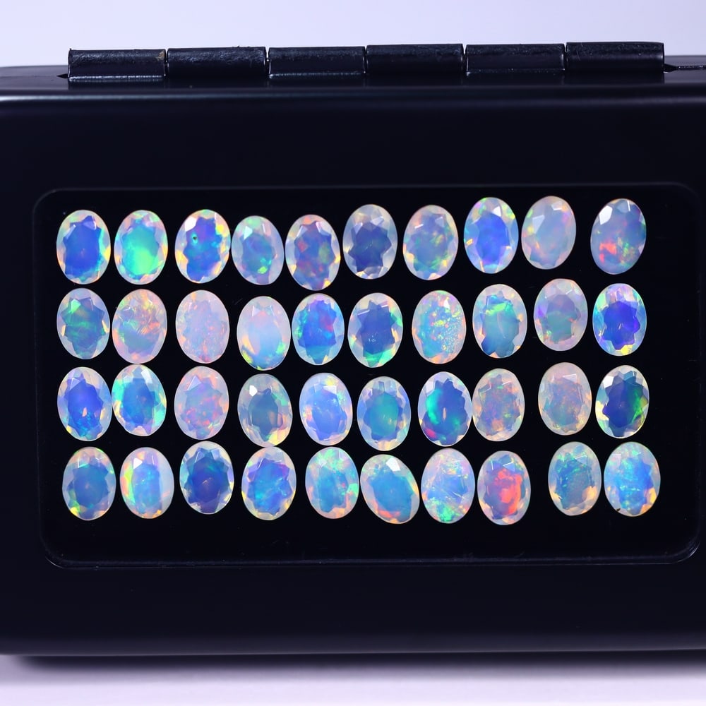 *20.13Ct Calibrated 7x5mm Faceted Welo Opal Set - Ethiopian Opal, 1014B: Ksmith Heritage Auctioneers Subject: Natural Ethiopian Welo Opal Origin: Ethiopia Carat Weight: 20.13Ct Treatment: Natural Untreated Type: Faceted, Polished