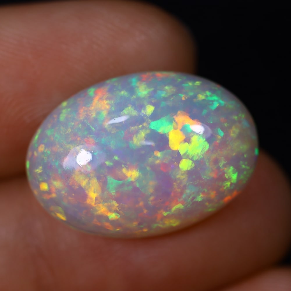 *11.18Ct Welo Opal Polished - Ethiopian Opal , 445C: Ksmith Heritage Auctioneers Subject: Natural Ethiopian Welo Opal Origin: Ethiopia Carat Weight: 11.18Ct Dimension: 20.1x14x8.3 mm Treatment: Natural Untreated Type: Caboch
