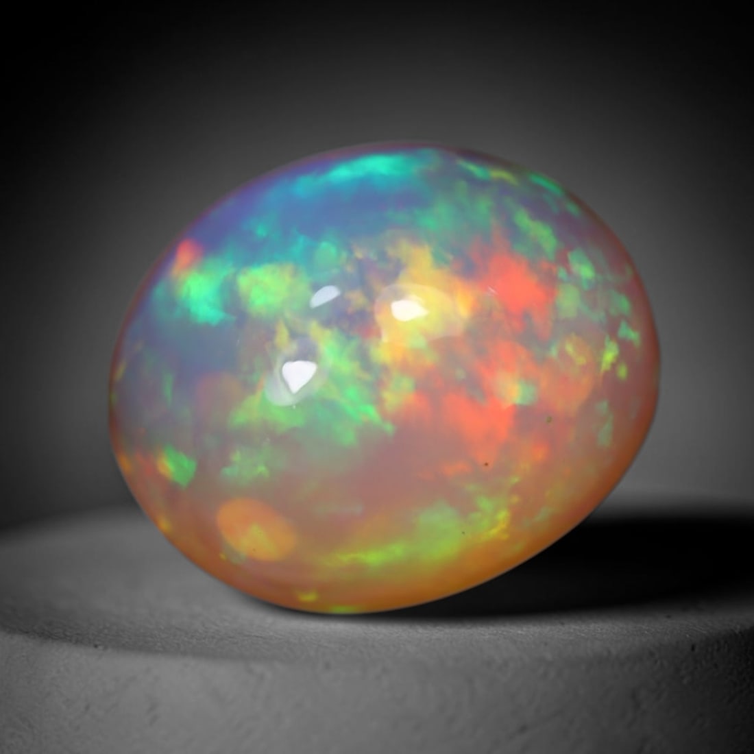 4.68Ct Welo Opal Polished - Ethiopian Opal, 128B: Ksmith Heritage Auctioneers Subject: Natural Ethiopian Welo Opal Origin: Ethiopia Carat Weight: 4.68Ct Dimension: 13.8x11.4x6.8 mm Treatment: Natural Untreated Type: Cabochon,