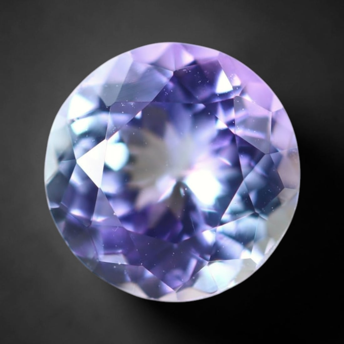 1.70Ct Tanzanite - Polished Faceted - Round Faceted , 313E: Ksmith Heritage Auctioneers Subject: Natural Tanzanite Origin: Tanzania Carat Weight: 1.70Ct Dimension: 7.4 x 7.4 x 4.4 mm Treatment: Heated Shape: Round Type: F