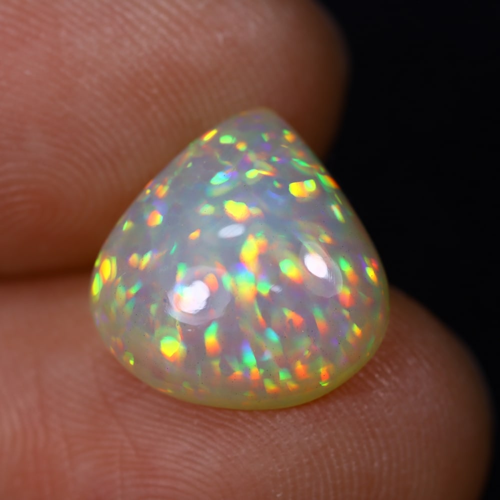 *3.56Ct Welo Opal Polished - Ethiopian Opal , 407C: Ksmith Heritage Auctioneers Subject: Natural Ethiopian Welo Opal Origin: Ethiopia Carat Weight: 3.56Ct Dimension: 12.7x12.4x5.1 mm Treatment: Natural Untreated Type: Caboc