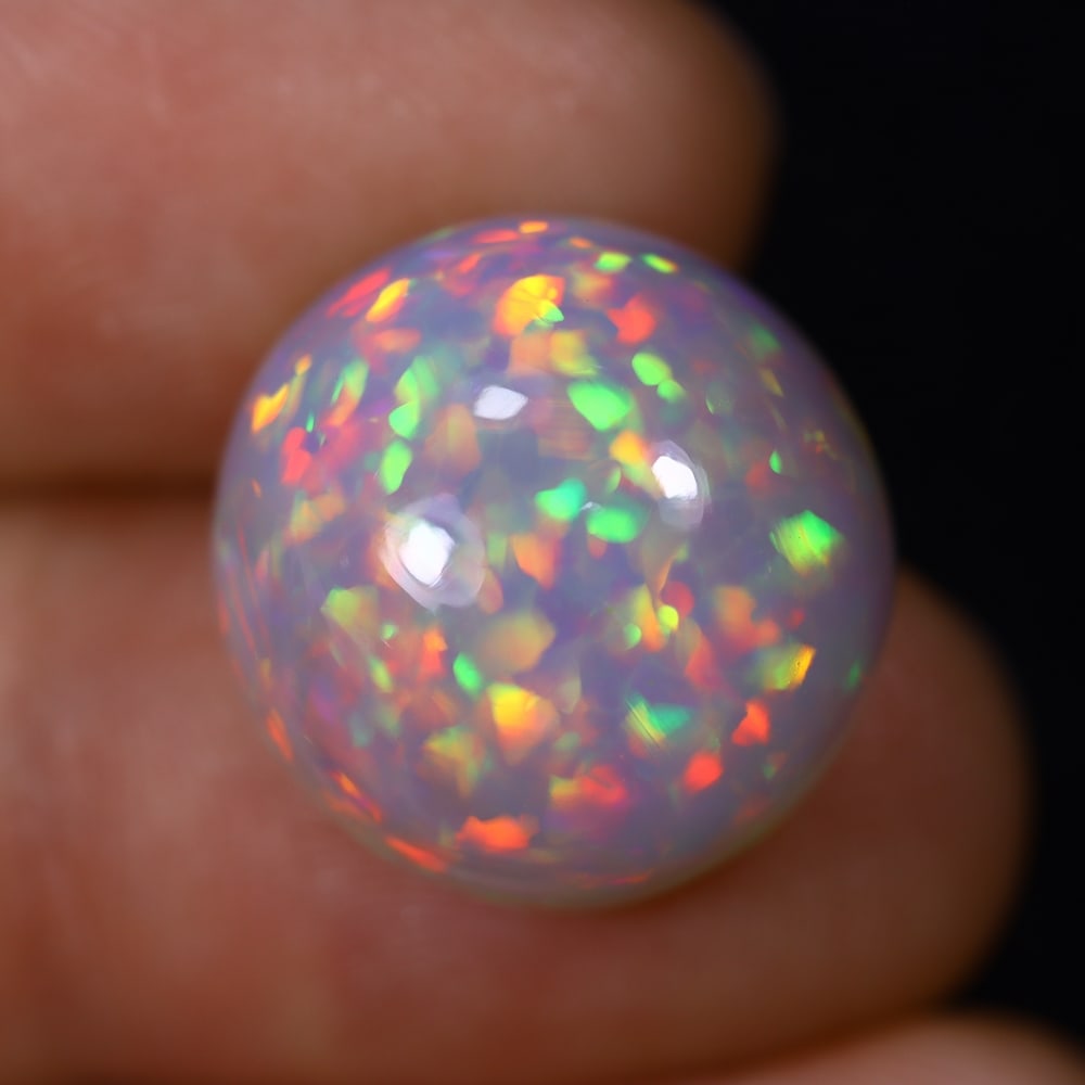 *12.38Ct Welo Opal Polished - Ethiopian Opal , 437C: Ksmith Heritage Auctioneers Subject: Natural Ethiopian Welo Opal Origin: Ethiopia Carat Weight: 12.38Ct Dimension: 16.1x15.6x9.8 mm Treatment: Natural Untreated Type: Cabo