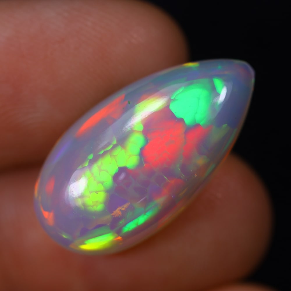 *8.50Ct Welo Opal Polished - Ethiopian Opal, 255B: Ksmith Heritage Auctioneers Subject: Natural Ethiopian Welo Opal Origin: Ethiopia Carat Weight: 8.50Ct Dimension: 22x11.5x7.5 mm Treatment: Natural Untreated Type: Cabochon, Polished