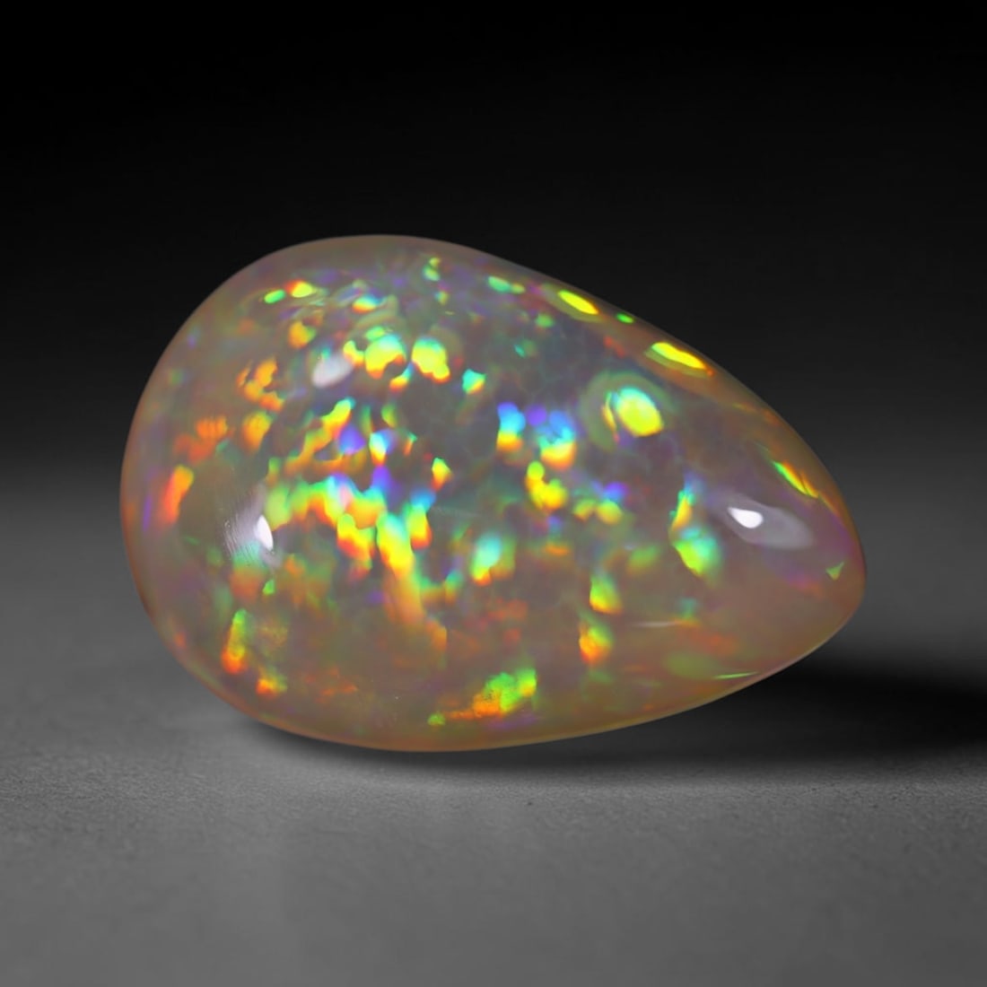 *11.38Ct Welo Opal Polished - Ethiopian Opal , 294E: Ksmith Heritage Auctioneers Subject: Natural Ethiopian Welo Opal Origin: Ethiopia Carat Weight: 11.38Ct Dimension: 21.3x14.6x7 mm Treatment: Natural Untreated Type: Caboch