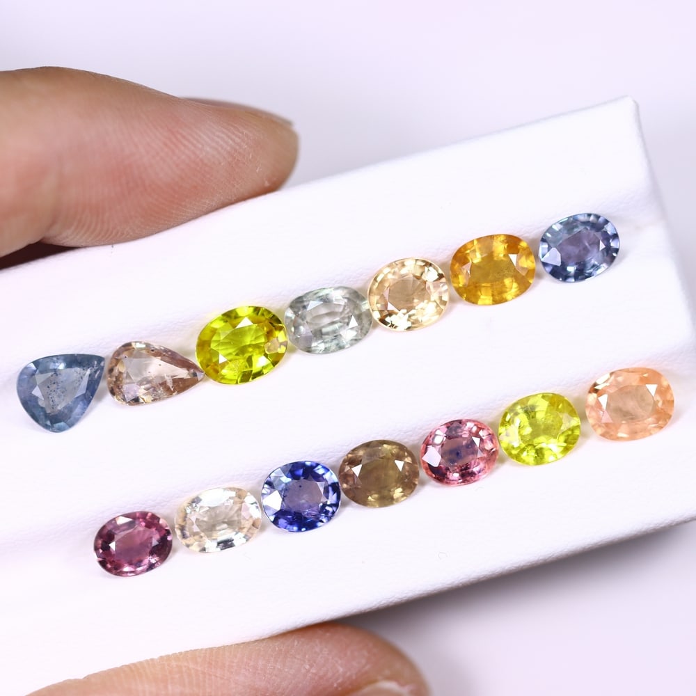 *11.79Ct Heated Fancy Sapphire Lot - Polished Faceted , 340C: Ksmith Heritage Auctioneers Subject: Natural Sapphire Carat Weight: 11.79Ct Dimension: 6.7x5.4x2.7 mm Treatment: Heated Type: Faceted, Polished