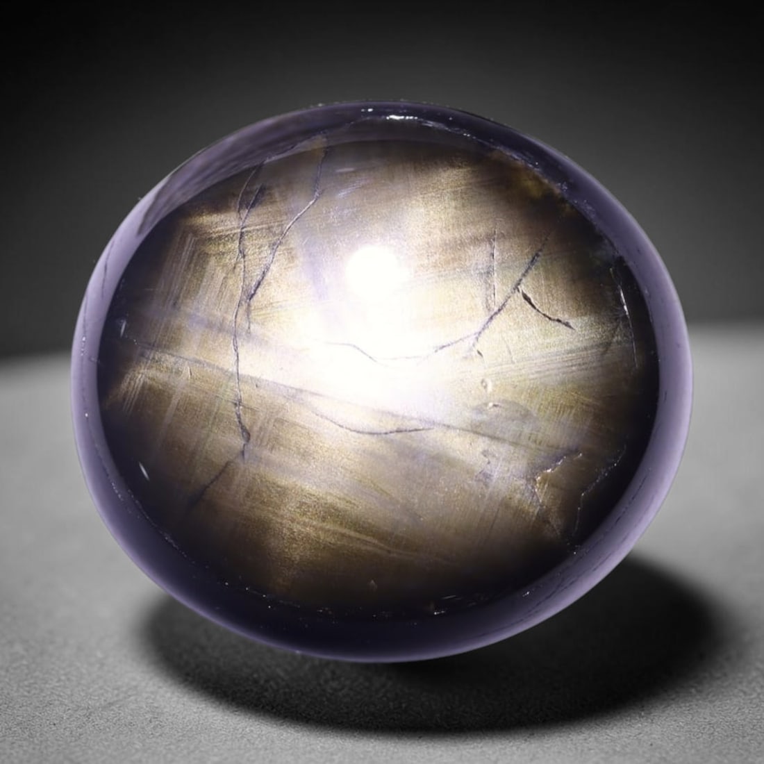 17.59cts 6 Rays Black Star Sapphire , 495E: Ksmith Heritage Auctioneers Subject: Natural 6 Rays Star Sapphire Origin: Myanmar Carat Weight: 17.59cts Dimension: 17.2x15.5x5.4 mm Treatment: Diffusion Type: Cabochon, P