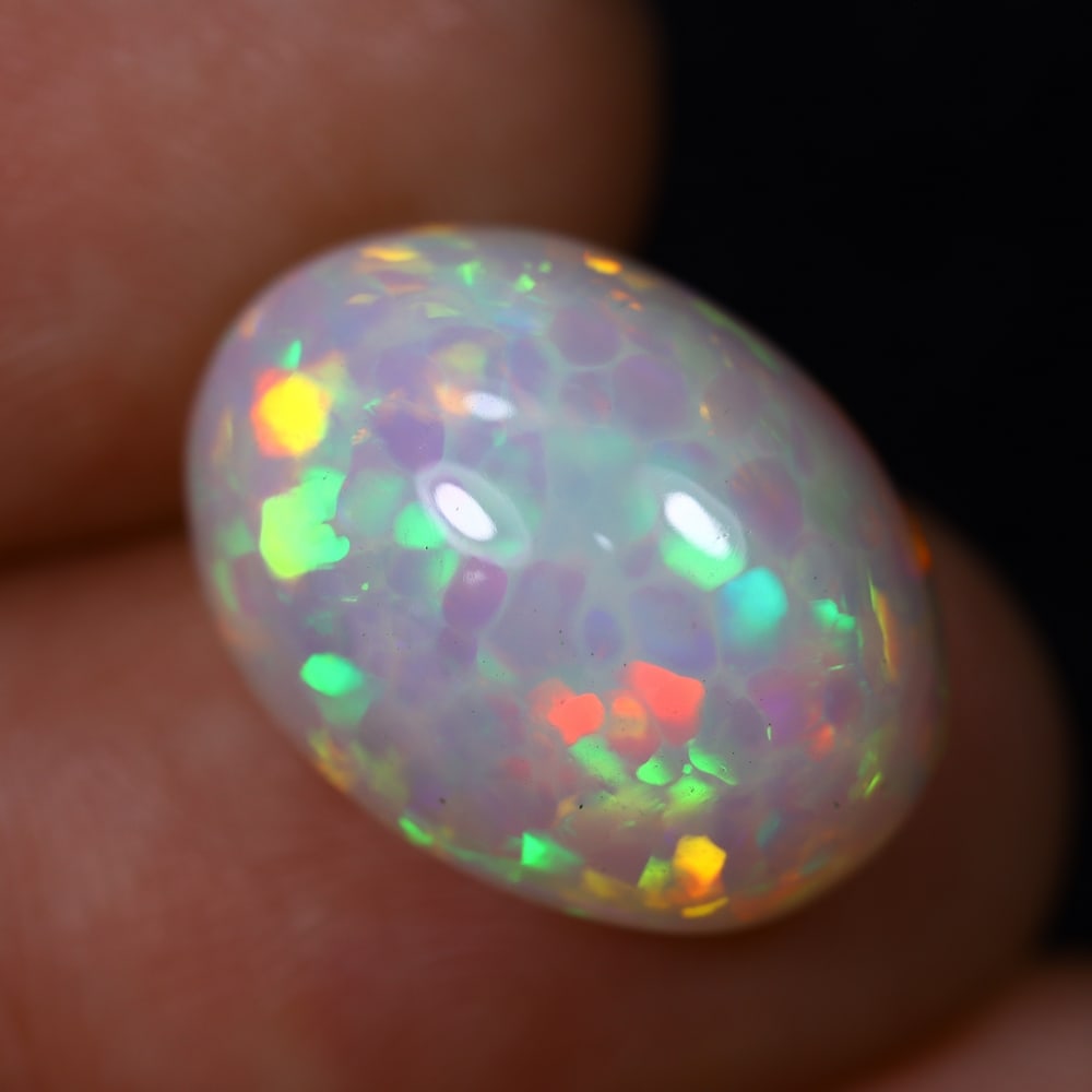 *7.86Ct Welo Opal Polished - Ethiopian Opal , 414C: Ksmith Heritage Auctioneers Subject: Natural Ethiopian Welo Opal Origin: Ethiopia Carat Weight: 7.86Ct Dimension: 16.8x12.5x8.8 mm Treatment: Natural Untreated Type: Caboc