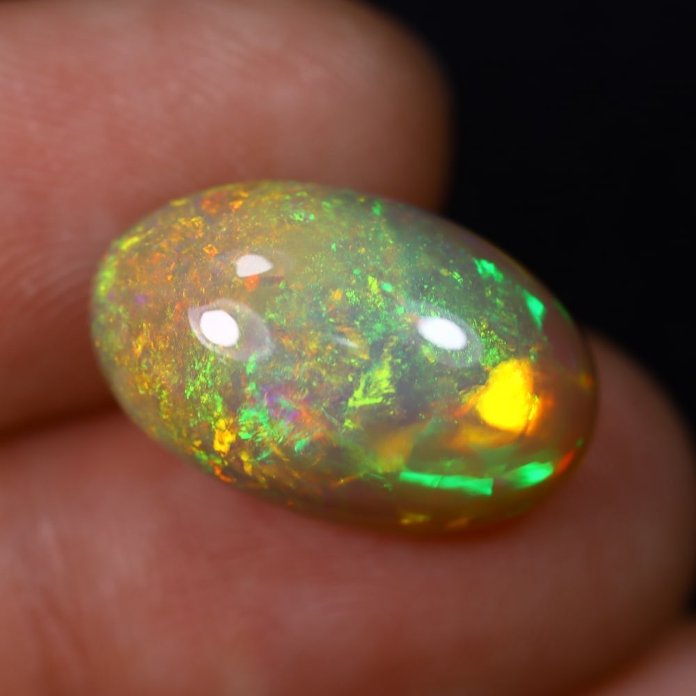 *7.78Ct Welo Opal Polished - Ethiopian Opal , 423C: Ksmith Heritage Auctioneers Subject: Natural Ethiopian Welo Opal Origin: Ethiopia Carat Weight: 7.78Ct Dimension: 17.7x11.2x8 mm Treatment: Natural Untreated Type: Cabocho