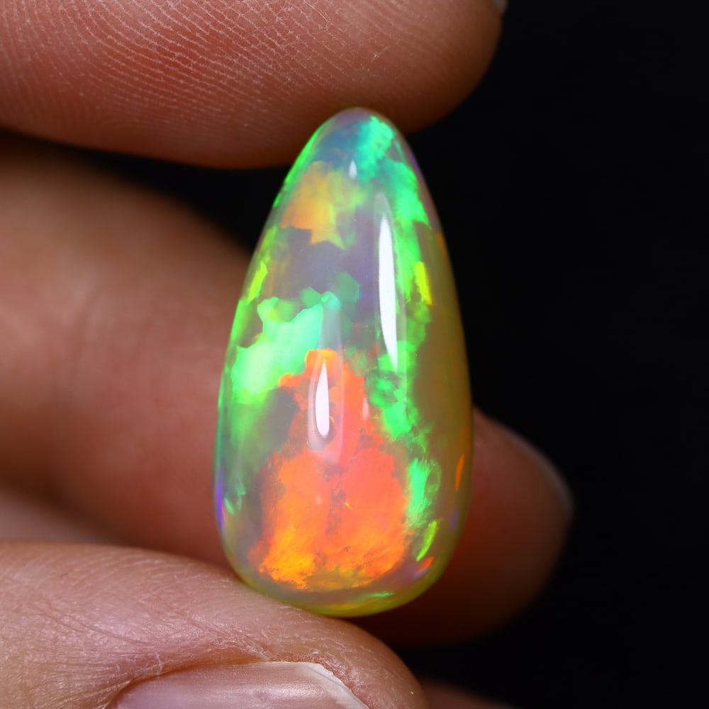 *12.78Ct Teardrop Welo Opal - Ethiopian Opal, 378C: Ksmith Heritage Auctioneers Subject: Natural Ethiopian Welo Opal Origin: Ethiopia Carat Weight: 12.78Ct Dimension: 22.2x11.3x10 mm Treatment: Natural Untreated Type: Cabochon,