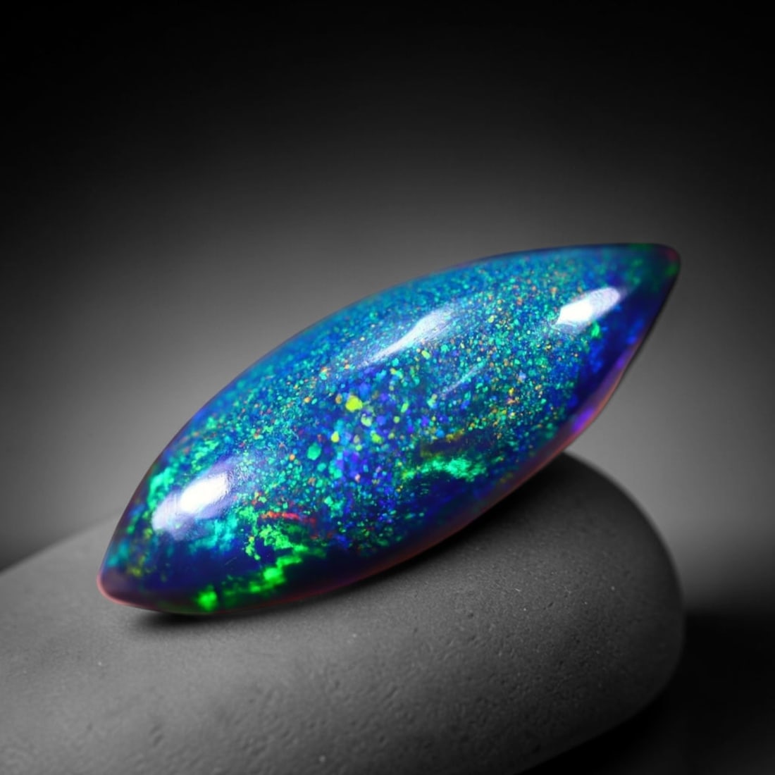 *2.77Ct Smoked Welo Opal Polished - Ethiopian Opal , 314C: Ksmith Heritage Auctioneers Subject: Natural Ethiopian Welo Opal Origin: Ethiopia Carat Weight: 2.77Ct Dimension: 18.1x6.9x4.7 mm Treatment: Smoked Type: Cabochon, Polishe