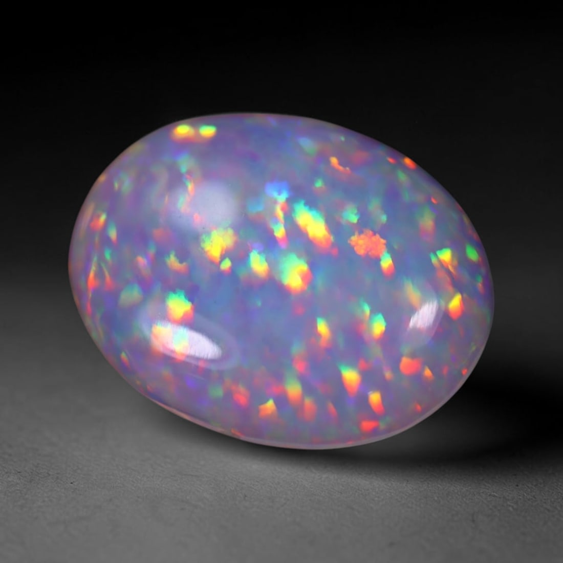 *6.52Ct Welo Opal Polished - Ethiopian Opal , 13E: Ksmith Heritage Auctioneers Subject: Natural Ethiopian Welo Opal Origin: Ethiopia Carat Weight: 6.52Ct Dimension: 18.1x14.3x4.7 mm Treatment: Natural Untreated Type: Caboc