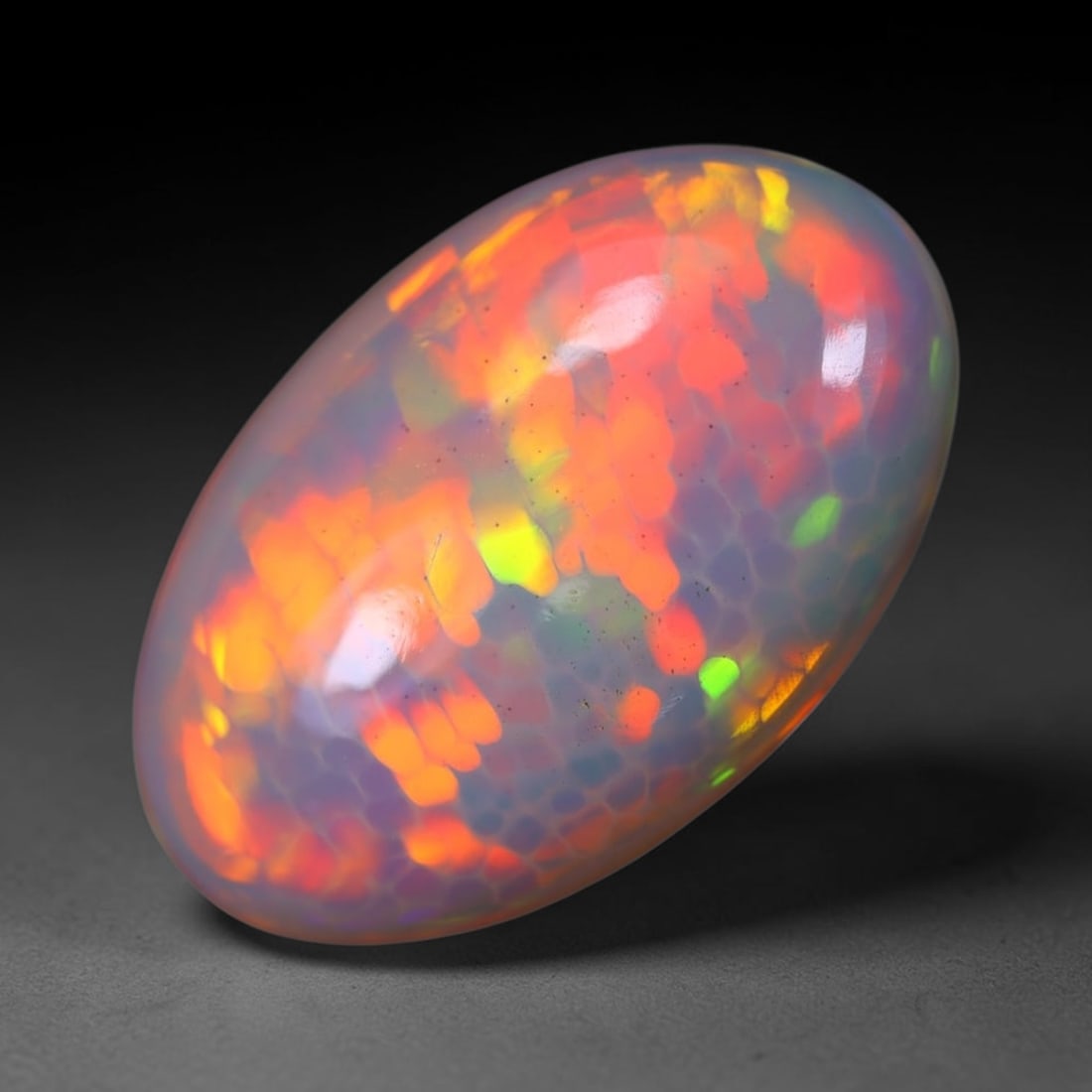 *7.83Ct Welo Opal Polished - Ethiopian Opal, 209B: Ksmith Heritage Auctioneers Subject: Natural Ethiopian Welo Opal Origin: Ethiopia Carat Weight: 7.83Ct Dimension: 20.3x13x5.8 mm Treatment: Natural Untreated Type: Cabochon, Po