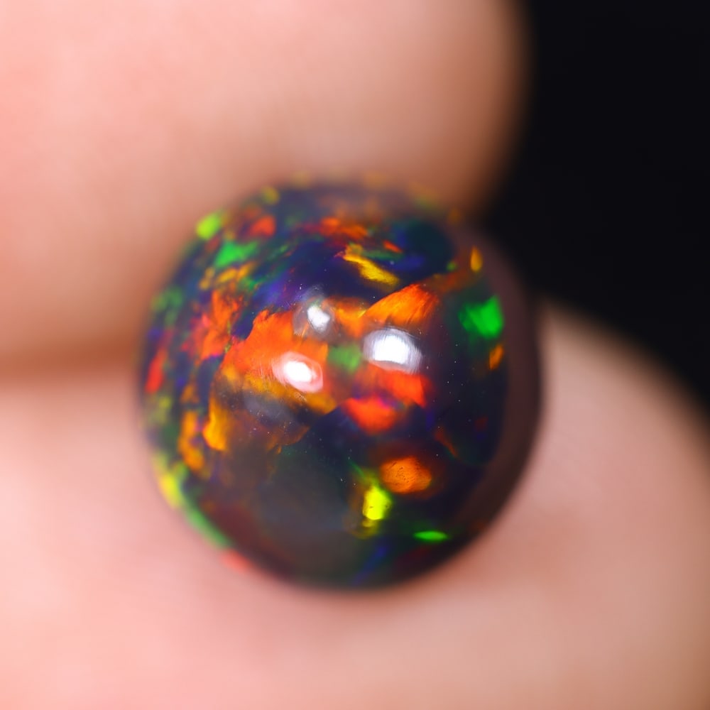 *2.86Ct Welo Black Opal Polished - Ethiopian Opal , 760E: Ksmith Heritage Auctioneers Subject: Natural Ethiopian Welo Black Opal Origin: Ethiopia Carat Weight: 2.86Ct Dimension: 9.9x9.7x6.7 mm Treatment: Smoked Type: Cabochon, Po