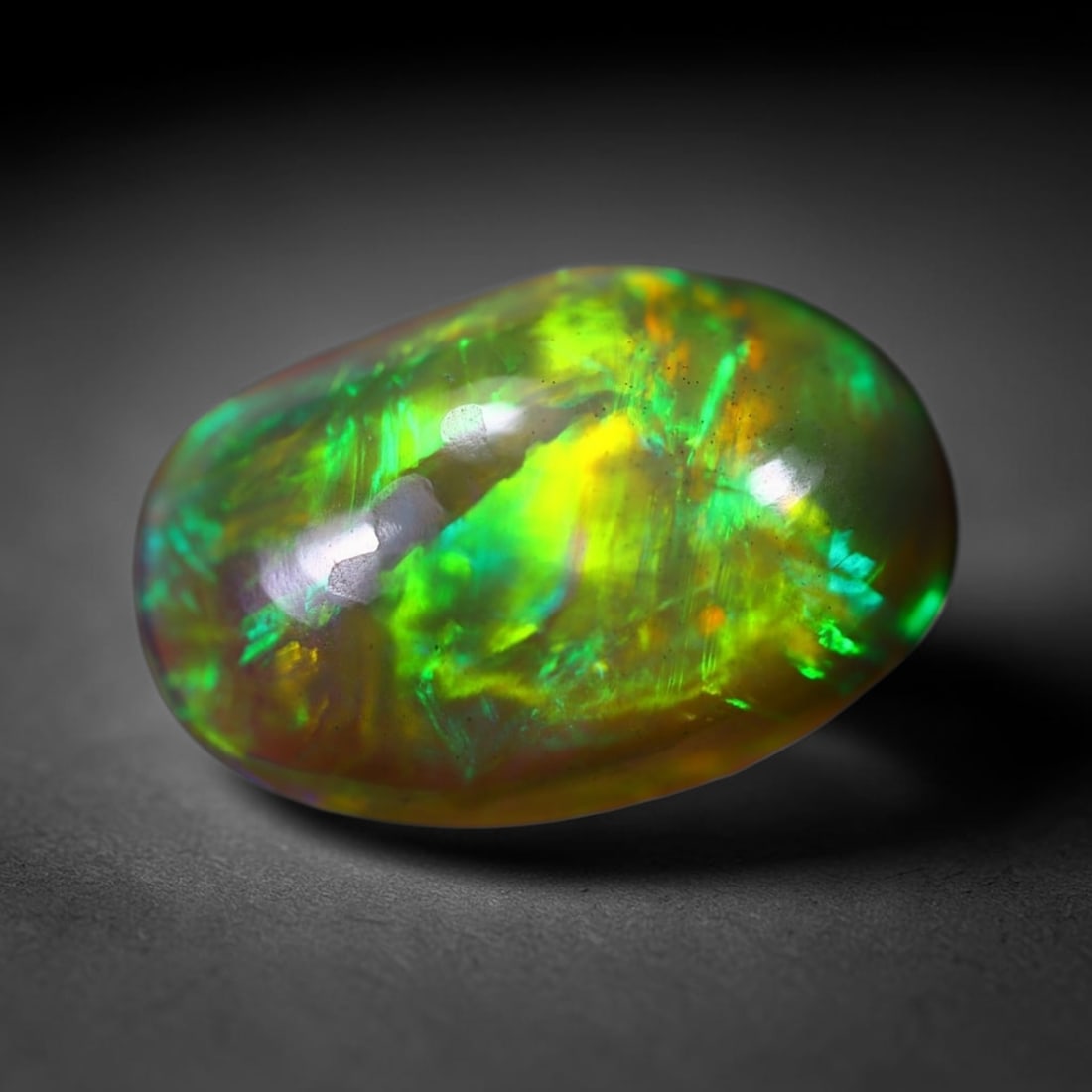 *4.49Ct Welo Black Opal Polished - Ethiopian Opal, 642B: Ksmith Heritage Auctioneers Subject: Natural Ethiopian Welo Black Opal Origin: Ethiopia Carat Weight: 4.49Ct Dimension: 15.3x10.2x5.4 mm Treatment: Smoked Type: Cabochon, Polis