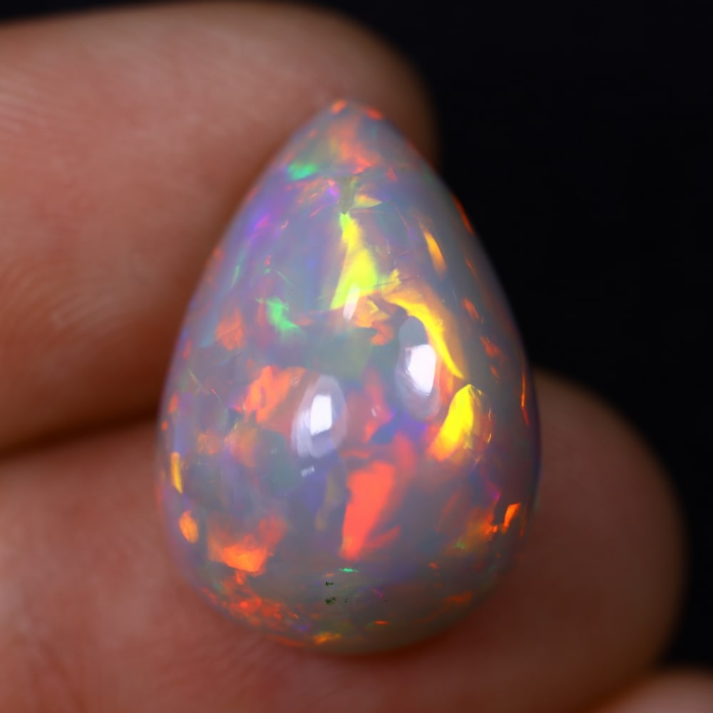 *12.42Ct Welo Opal Polished - Ethiopian Opal , 431C: Ksmith Heritage Auctioneers Subject: Natural Ethiopian Welo Opal Origin: Ethiopia Carat Weight: 12.42Ct Dimension: 19.2x13.1x11.1 mm Treatment: Natural Untreated Type: Cab