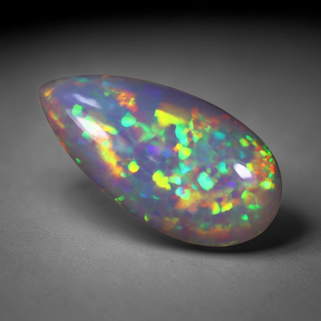 *6.75Ct Welo Opal Polished - Ethiopian Opal , 105E: Ksmith Heritage Auctioneers Subject: Natural Ethiopian Welo Opal Origin: Ethiopia Carat Weight: 6.75Ct Dimension: 22x11.3x6 mm Treatment: Natural Untreated Type: Cabochon,