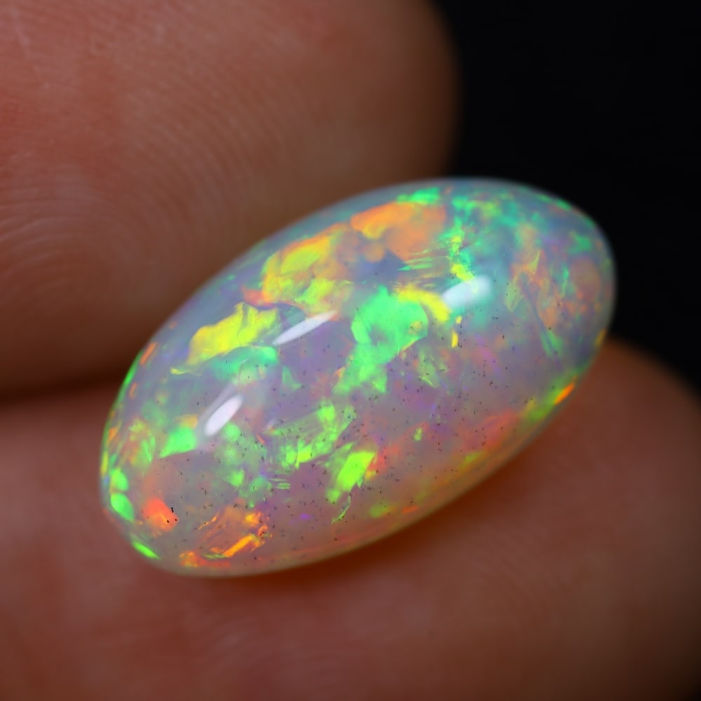 *5.28Ct Welo Opal Polished - Ethiopian Opal, 1135B: Ksmith Heritage Auctioneers Subject: Natural Ethiopian Welo Opal Origin: Ethiopia Carat Weight: 5.28Ct Dimension: 16.9x9.5x6.2 mm Treatment: Natural Untreated Type: Cabochon, P
