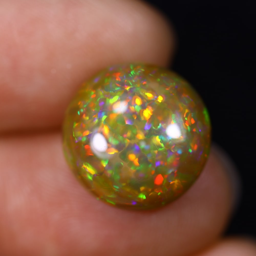 *6.36Ct Welo Opal Polished - Ethiopian Opal , 188C: Ksmith Heritage Auctioneers Subject: Natural Ethiopian Welo Opal Origin: Ethiopia Carat Weight: 6.36Ct Dimension: 14.2x14x5.9 mm Treatment: Natural Untreated Type: Cabocho