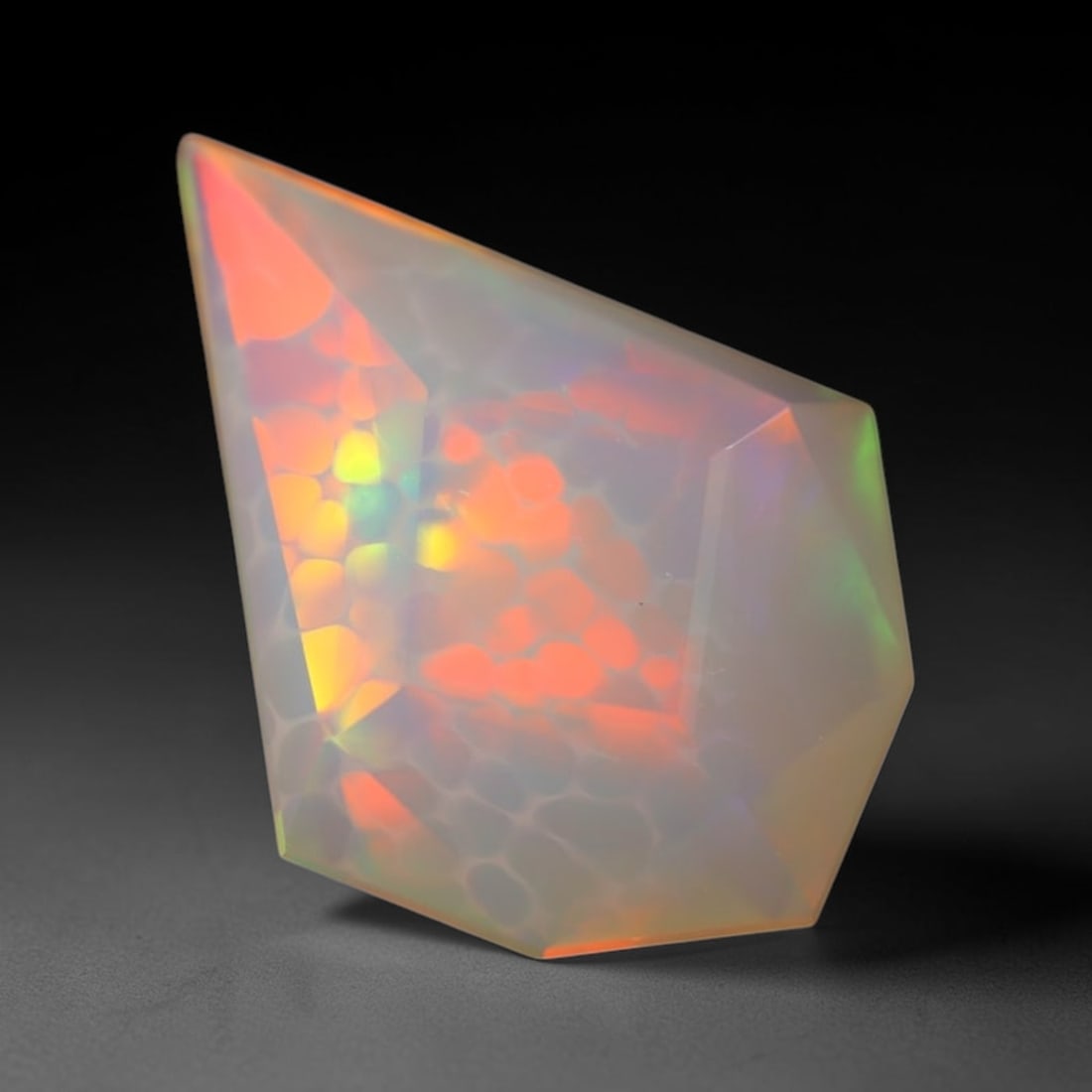 *2.19Ct Special Cut Welo Opal Polished - Ethiopian Opal , 166E: Ksmith Heritage Auctioneers Subject: Natural Ethiopian Welo Opal Origin: Ethiopia Carat Weight: 2.19Ct Dimension: 13.8x10.2x5.1 mm Treatment: Unheated Type: Faceted, Polis