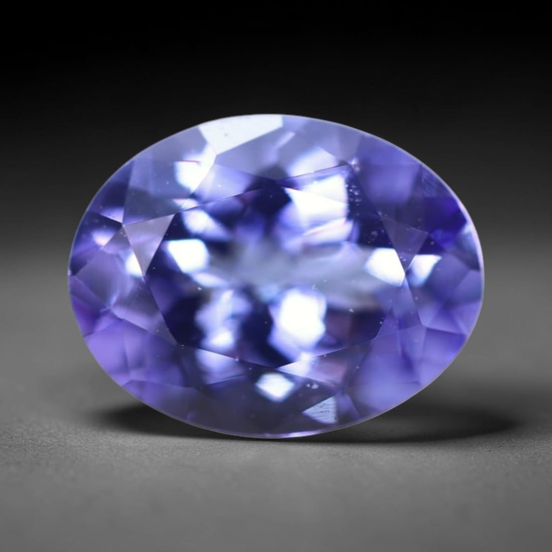1.83Ct Tanzanite Faceted - Oval Polished , 317B: Ksmith Heritage Auctioneers Subject: Natural Tanzanite Origin: Tanzania Dimension: 8.9x6.8x4.4 mm Treatment: Heated Shape: Oval Type: Faceted, Polished