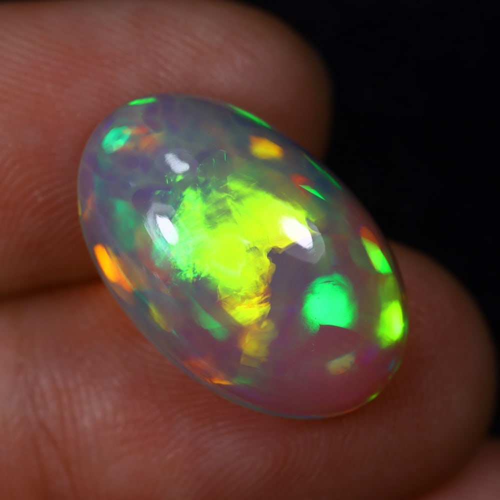 *6.99Ct Welo Opal Polished - Ethiopian Opal , 452C: Ksmith Heritage Auctioneers Subject: Natural Ethiopian Welo Opal Origin: Ethiopia Carat Weight: 6.99Ct Dimension: 19.1x12.4x6.1 mm Treatment: Natural Untreated Type: Caboc