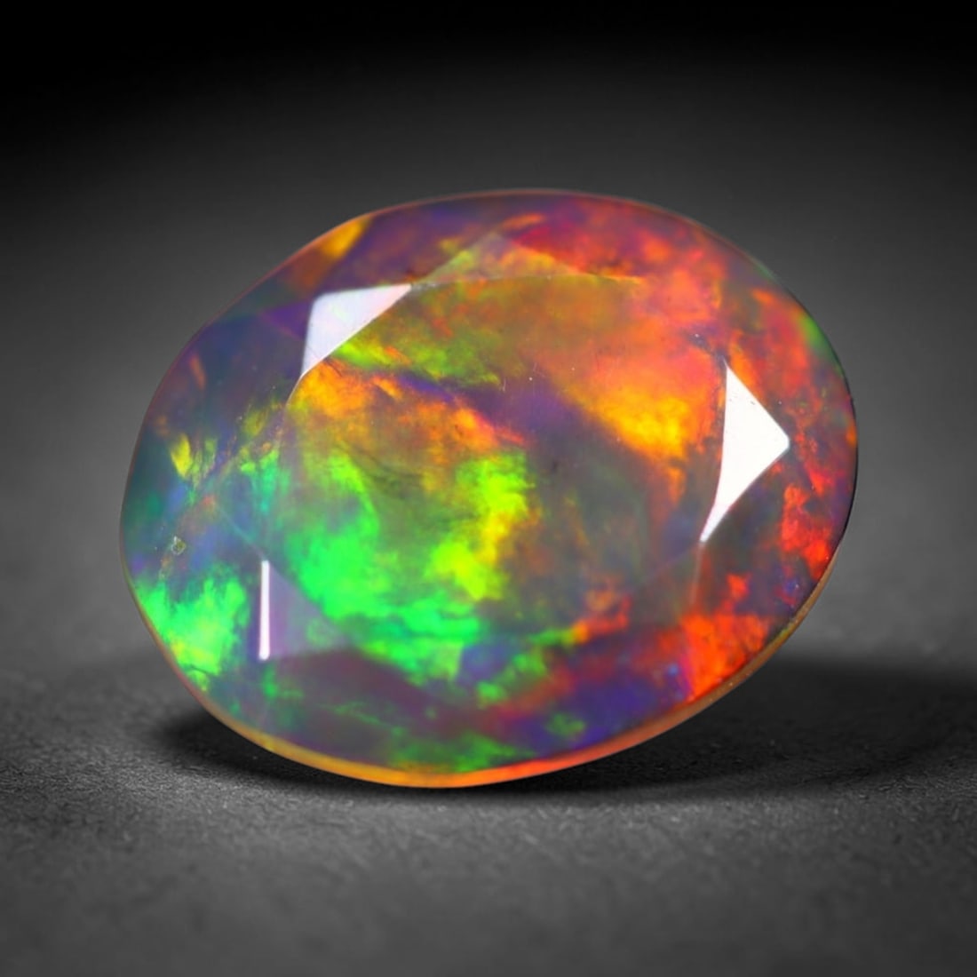 *2.04Ct Welo Black Opal Polished - Ethiopian Opal - Oval Faceted , 119E: Ksmith Heritage Auctioneers Subject: Natural Ethiopian Welo Black Opal Origin: Ethiopia Carat Weight: 2.04Ct Dimension: 10.9 x 8.7 x 4.7 mm Treatment: Smoked Shape: Oval