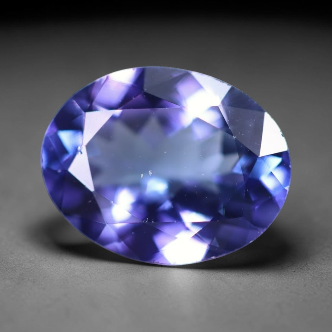 IGI Certified 2.30Ct Tanzanite - Polished Faceted - Oval Faceted , 62E: Ksmith Heritage Auctioneers Subject: Natural Tanzanite Origin: Tanzania Carat Weight: 2.30Ct Dimension: 9.9x7.7x4.2mm Treatment: Heated Shape: Oval Type: Faceted