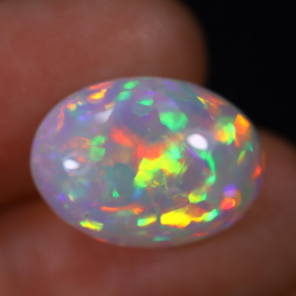 *7.13Ct Welo Opal Polished - Ethiopian Opal , 841E: Ksmith Heritage Auctioneers Subject: Natural Ethiopian Welo Opal Origin: Ethiopia Carat Weight: 7.13Ct Dimension: 16.5x12.1x6.4 mm Treatment: Natural Untreated Type: Caboc