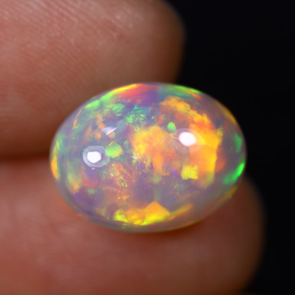 *6.63Ct Welo Opal Polished - Ethiopian Opal , 398C: Ksmith Heritage Auctioneers Subject: Natural Ethiopian Welo Opal Origin: Ethiopia Carat Weight: 6.63Ct Dimension: 14.4x11x8.1 mm Treatment: Natural Untreated Type: Cabocho
