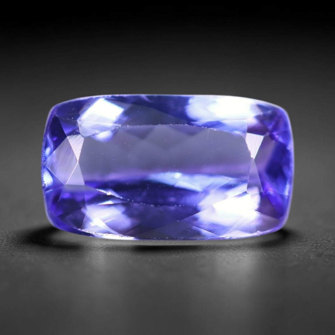 1.99Ct Tanzanite Faceted - Rectangle Polished , 167B: Ksmith Heritage Auctioneers Subject: Natural Tanzanite Origin: Tanzania Dimension: 9.9x5.7x3.8 mm Treatment: Heated Shape: Rectangle Type: Faceted, Polished