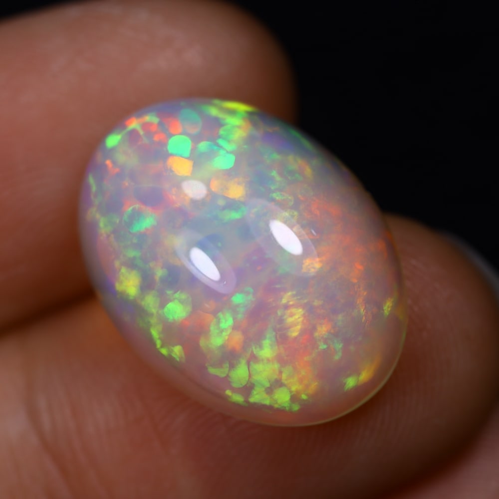 *8.06Ct Welo Opal Polished - Ethiopian Opal - Oval Cabochon, 614B: Ksmith Heritage Auctioneers Subject: Natural Ethiopian Welo Opal Origin: Ethiopia Carat Weight: 8.06Ct Dimension: 18.8 x 13.8 x 7.1 mm Treatment: Natural Untreated Shape: Oval