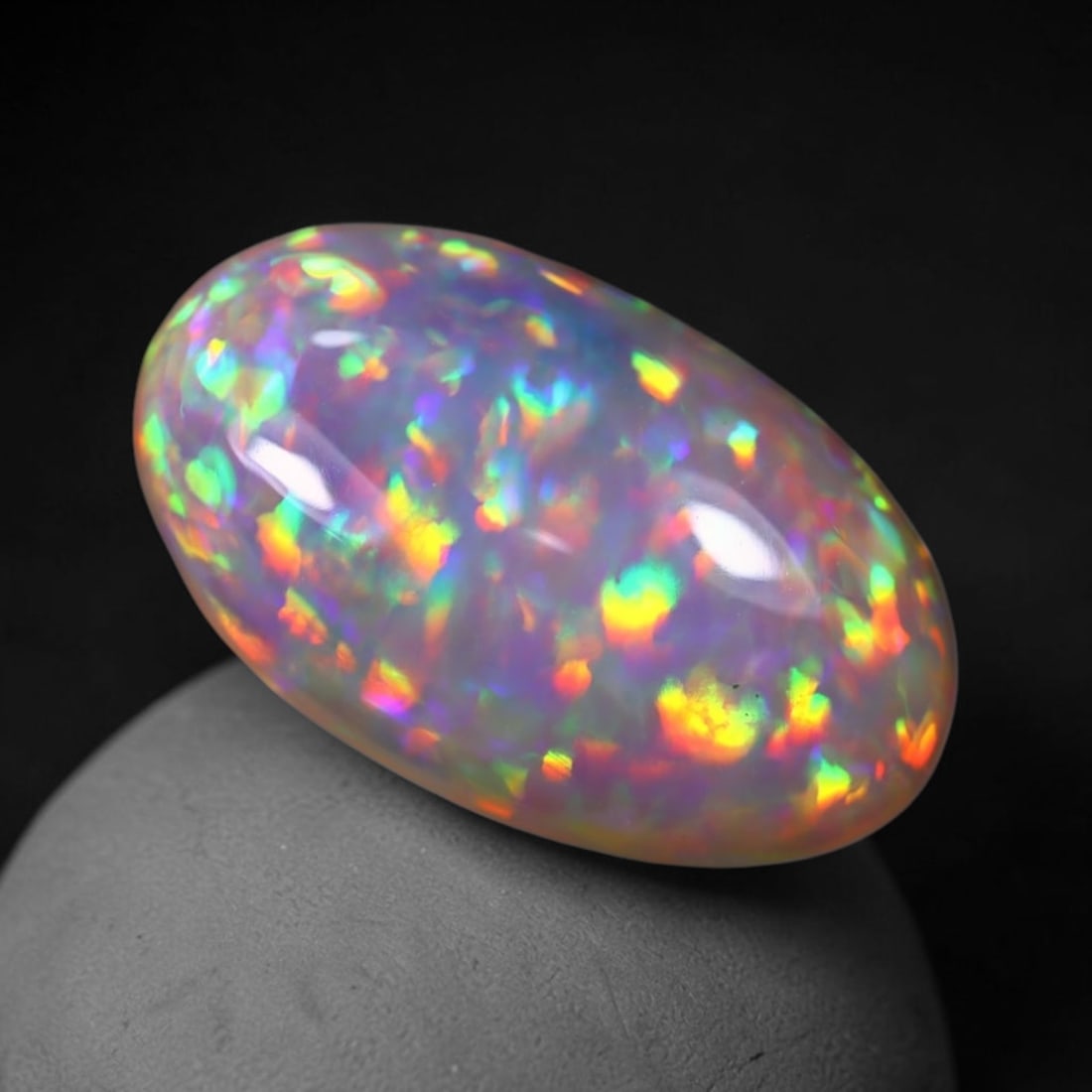 *4.98Ct Welo Opal - Ethiopian Opal, 379C: Ksmith Heritage Auctioneers Subject: Natural Ethiopian Welo Opal Origin: Ethiopia Carat Weight: 4.98Ct Dimension: 16.6x9.9x5.4 mm Treatment: Natural Untreated Type: Cabochon, P