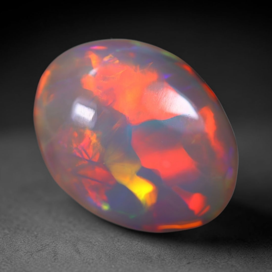*7.05Ct Welo Opal Polished - Ethiopian Opal , 222E: Ksmith Heritage Auctioneers Subject: Natural Ethiopian Welo Opal Origin: Ethiopia Carat Weight: 7.05Ct Dimension: 17x13.4x6.2 mm Treatment: Natural Untreated Type: Cabocho