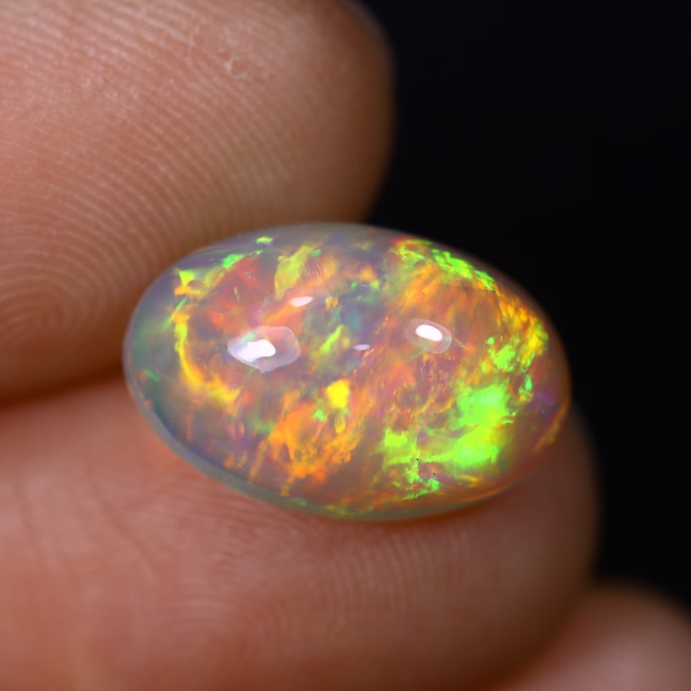 *4.70Ct Welo Opal Polished - Ethiopian Opal , 396C: Ksmith Heritage Auctioneers Subject: Natural Ethiopian Welo Opal Origin: Ethiopia Carat Weight: 4.70Ct Dimension: 14.7x9.7x6.8 mm Treatment: Natural Untreated Type: Caboch
