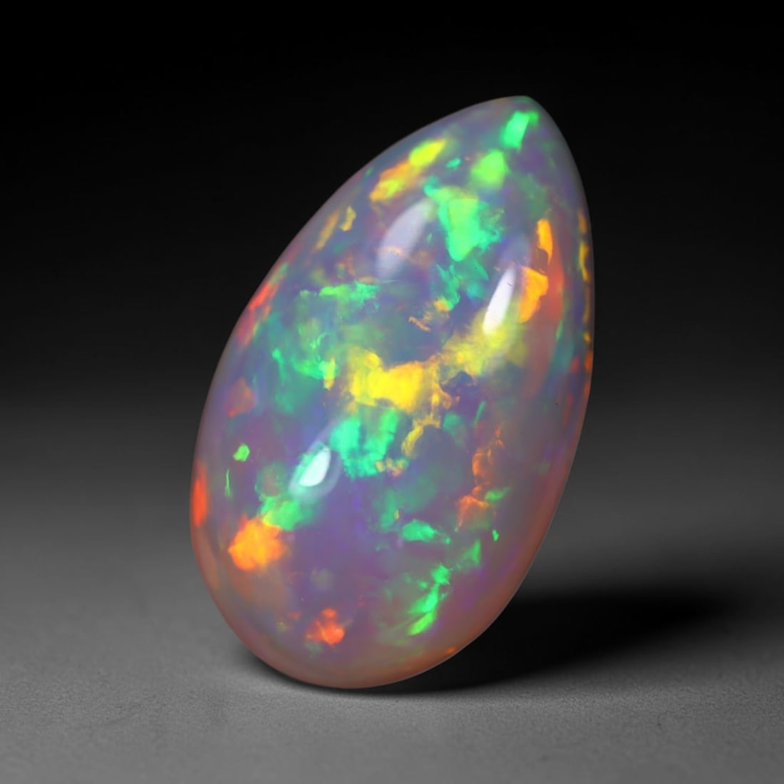 *9.04Ct Welo Opal Polished - Ethiopian Opal , 375E: Ksmith Heritage Auctioneers Subject: Natural Ethiopian Welo Opal Origin: Ethiopia Carat Weight: 9.04Ct Dimension: 20.8x12.2x6.8 mm Treatment: Natural Untreated Type: Caboc