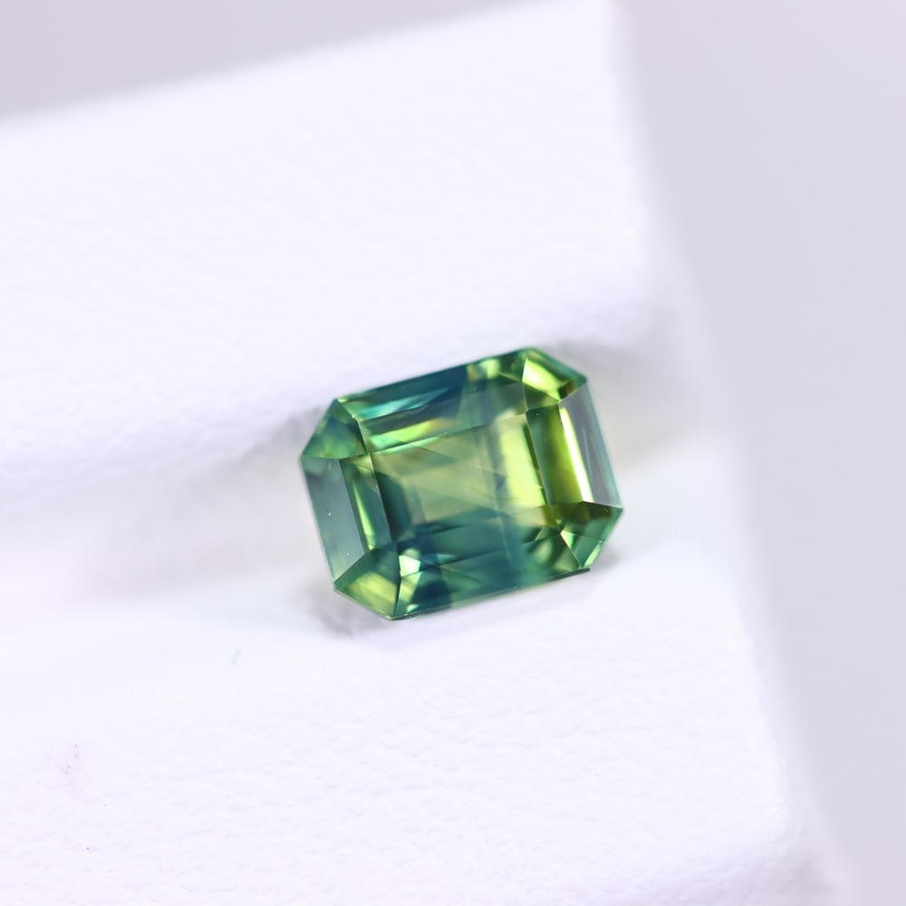 *1.26Ct Unheated Greenish Sapphire - Sri Lanka , 384C: Ksmith Heritage Auctioneers Subject: Natural Sapphire Carat Weight: 1.26 Ct Dimension: 6.5x5x3.7 mm Treatment: Unheated Type: Faceted, Polished
