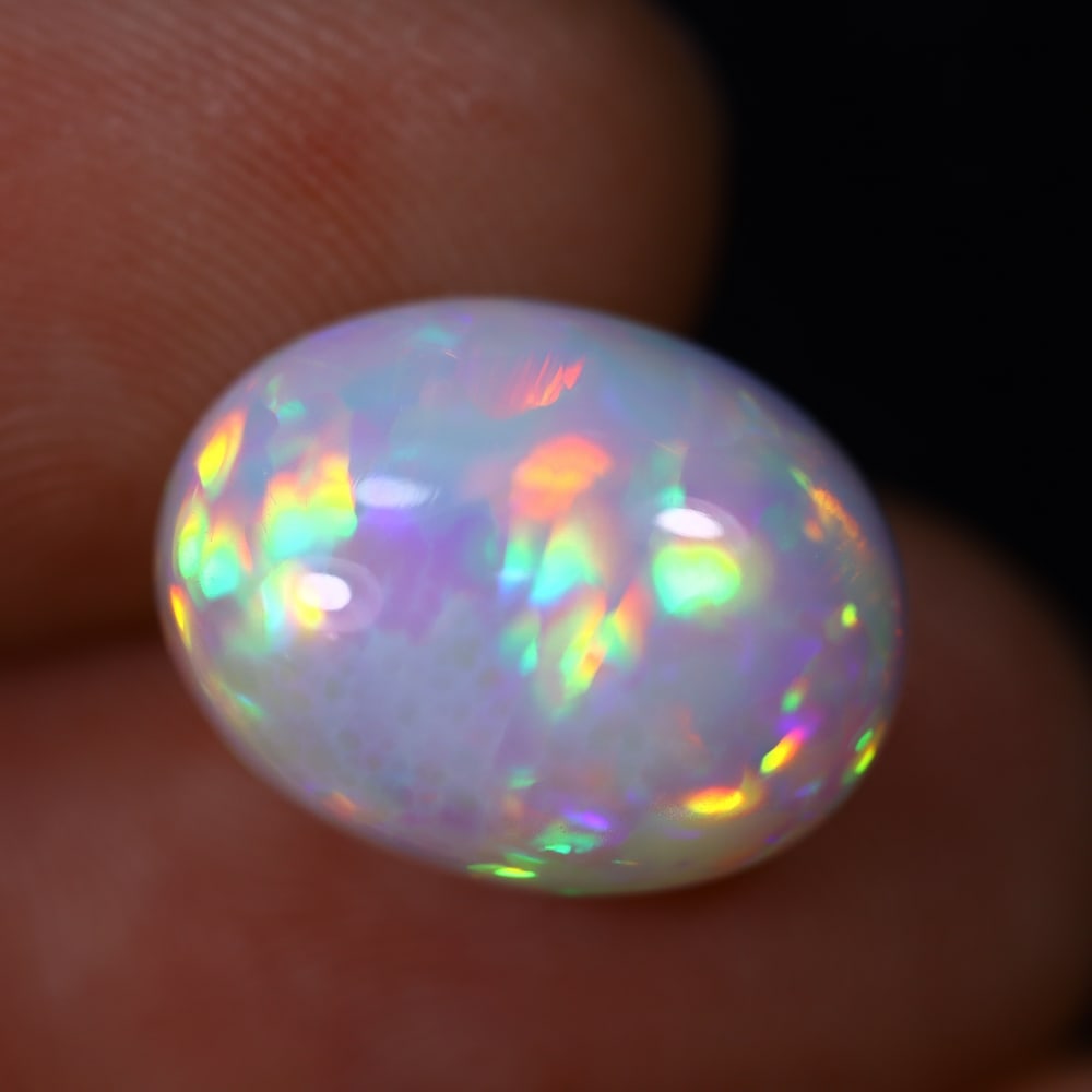 *5.43Ct Welo Opal Polished - Ethiopian Opal , 456C: Ksmith Heritage Auctioneers Subject: Natural Ethiopian Welo Opal Origin: Ethiopia Carat Weight: 5.43Ct Dimension: 14.1x10.9x7.3 mm Treatment: Natural Untreated Type: Caboc