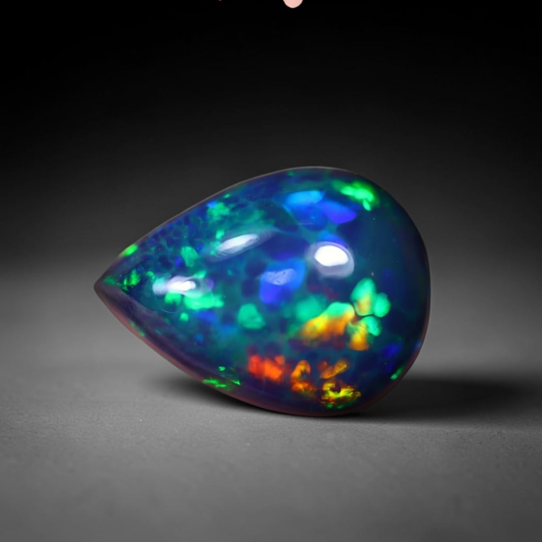 *2.60Ct Smoked Welo Opal Polished - Ethiopian Opal , 311C: Ksmith Heritage Auctioneers Subject: Natural Ethiopian Welo Opal Origin: Ethiopia Carat Weight: 2.60Ct Dimension: 12x9x5.1 mm Treatment: Smoked Type: Cabochon, Polished