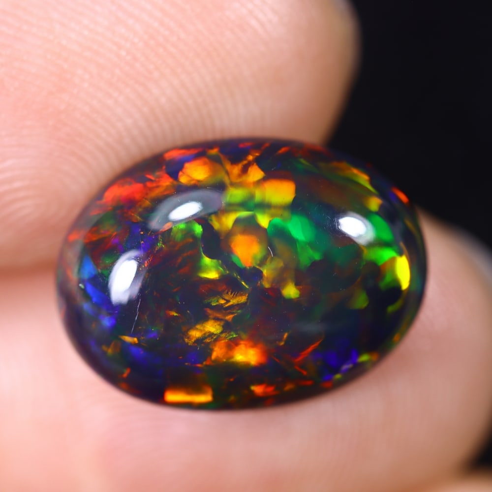 4.38Ct Natural Ethiopian Black Opal - 15.1x11.x5.1 mm , 602C: Ksmith Heritage Auctioneers Subject: Natural Ethiopian Welo Opal Origin: Ethiopia Treatment: Smoked