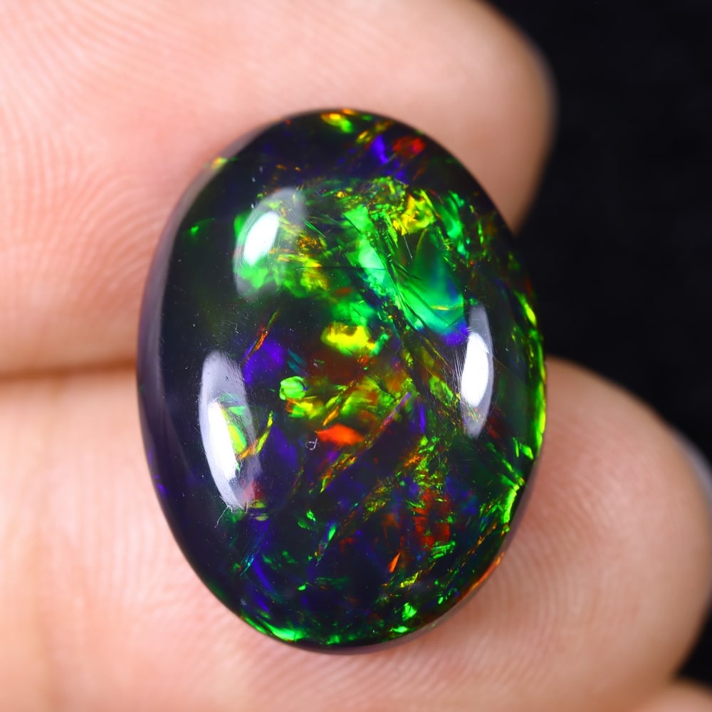 8.63Ct Natural Ethiopian Black Opal - 19.2x14.2x6.0 mm , 587C: Ksmith Heritage Auctioneers Subject: Natural Ethiopian Welo Opal Origin: Ethiopia Treatment: Smoked