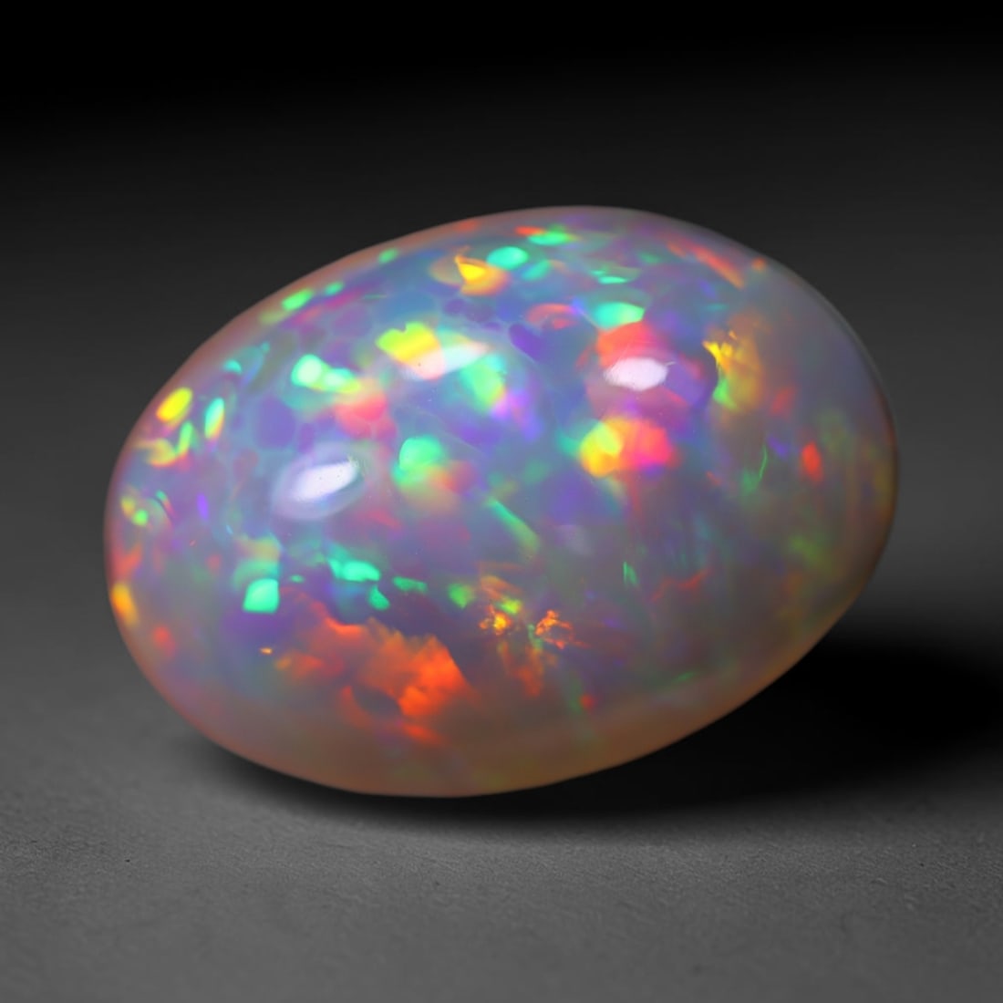 *11.79Ct Welo Opal Polished - Ethiopian Opal, 877B: Ksmith Heritage Auctioneers Subject: Natural Ethiopian Welo Opal Origin: Ethiopia Carat Weight: 11.79Ct Dimension: 18x12.9x10.1 mm Treatment: Natural Untreated Type: Cabochon,