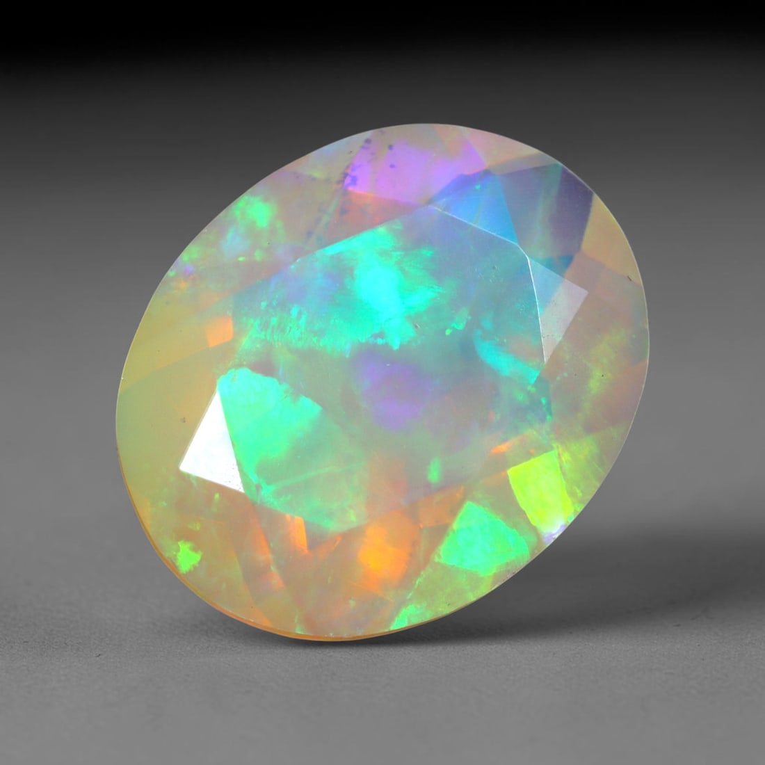 2.57Ct Natural Ethiopian Opal, Faceted Cut - 12.0x9.8x5.7 mm , 647C: Ksmith Heritage Auctioneers Subject: Natural Ethiopian Welo Opal Origin: Ethiopia Treatment: Unheated