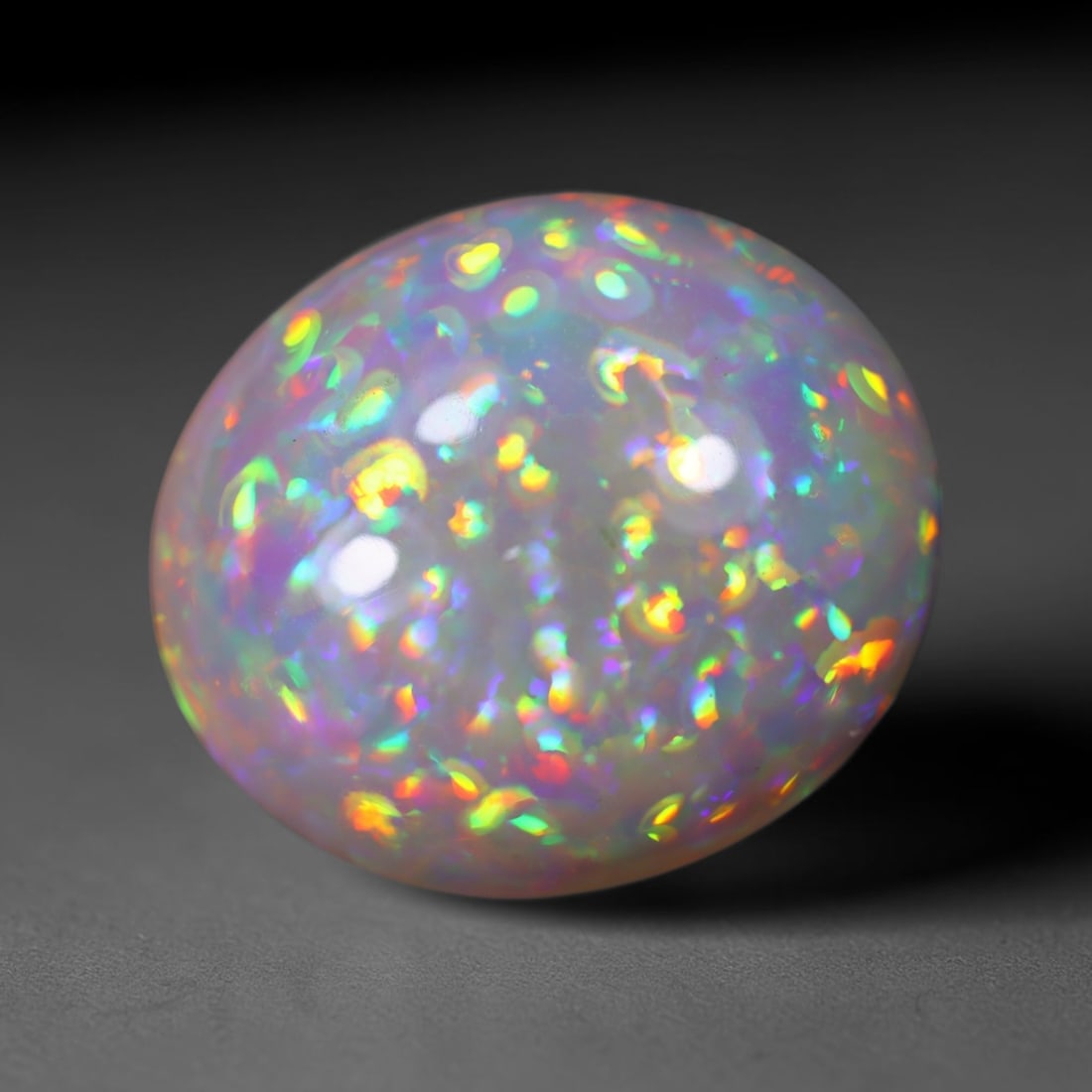 *19.88Ct Welo Opal Polished - Ethiopian Opal , 156E: Ksmith Heritage Auctioneers Subject: Natural Ethiopian Welo Opal Origin: Ethiopia Carat Weight: 19.88Ct Dimension: 21.1x18.3x10.9 mm Treatment: Natural Untreated Type: Cab