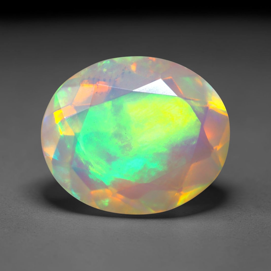 2.81Ct Natural Ethiopian Opal, Faceted Cut - 12.0x10.0x5.2 mm , 667C: Ksmith Heritage Auctioneers Subject: Natural Ethiopian Welo Opal Origin: Ethiopia Treatment: Unheated