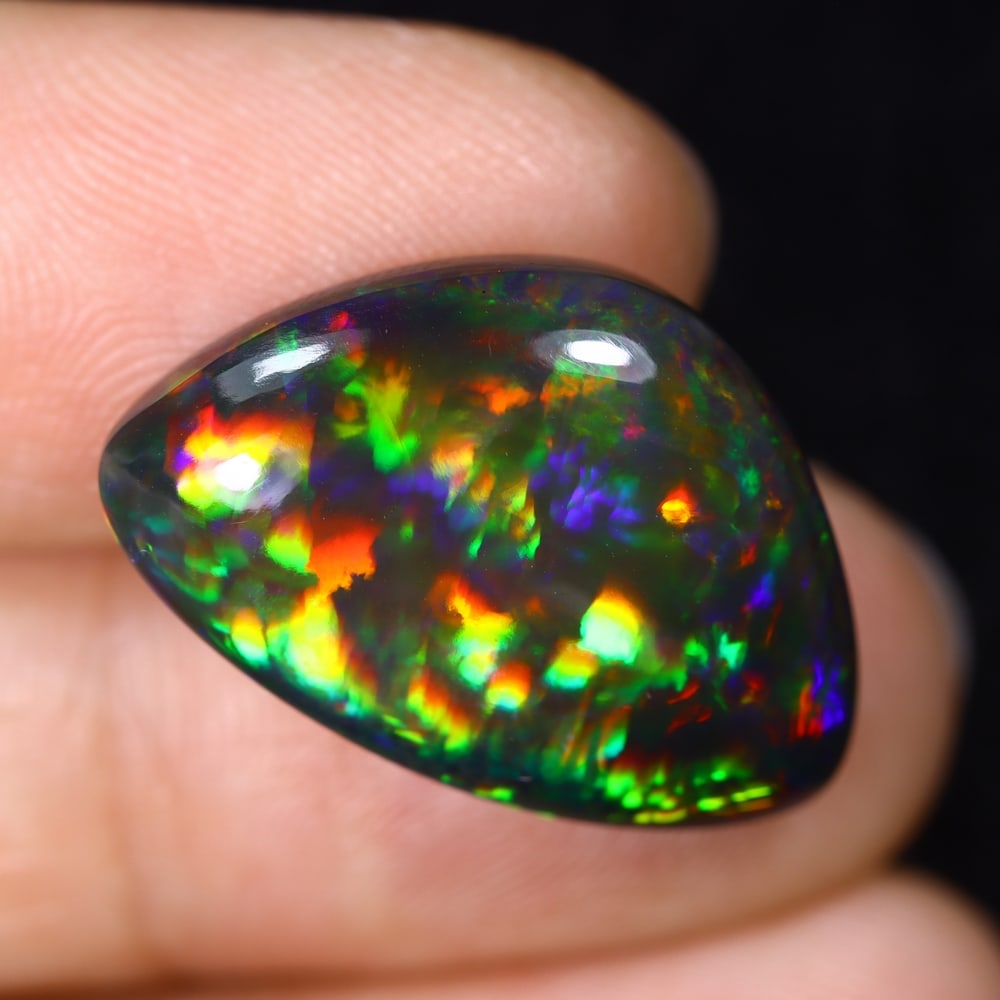 12.53Ct Natural Ethiopian Black Opal - 22.5x14.9x7.1 mm , 580C: Ksmith Heritage Auctioneers Subject: Natural Ethiopian Welo Opal Origin: Ethiopia Treatment: Smoked