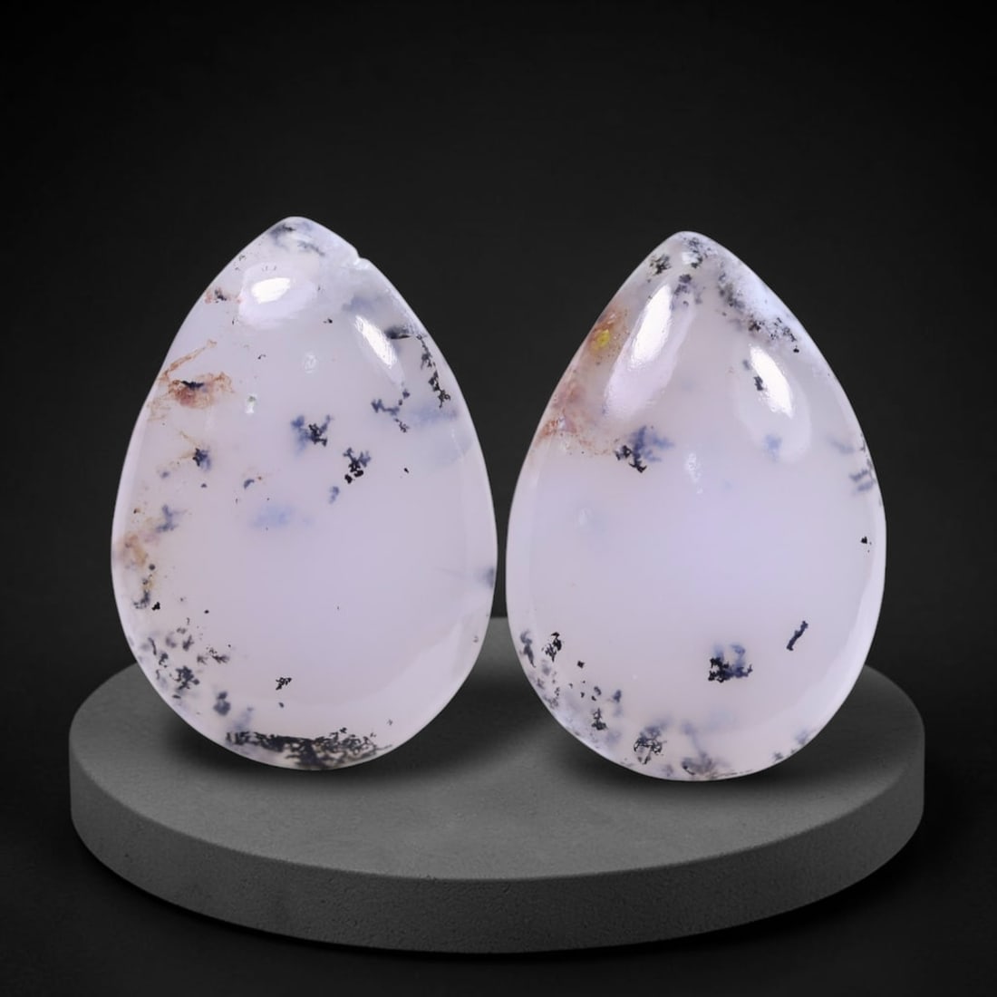 17.10Ct Dendrite Opal Pair - Cabochon Polished , 720E: Ksmith Heritage Auctioneers Subject: Natural Dendrite Opal Origin: India Dimension: 19.5x13.6x4.4 mm Treatment: No Treatment Type: Cabochon, Polished