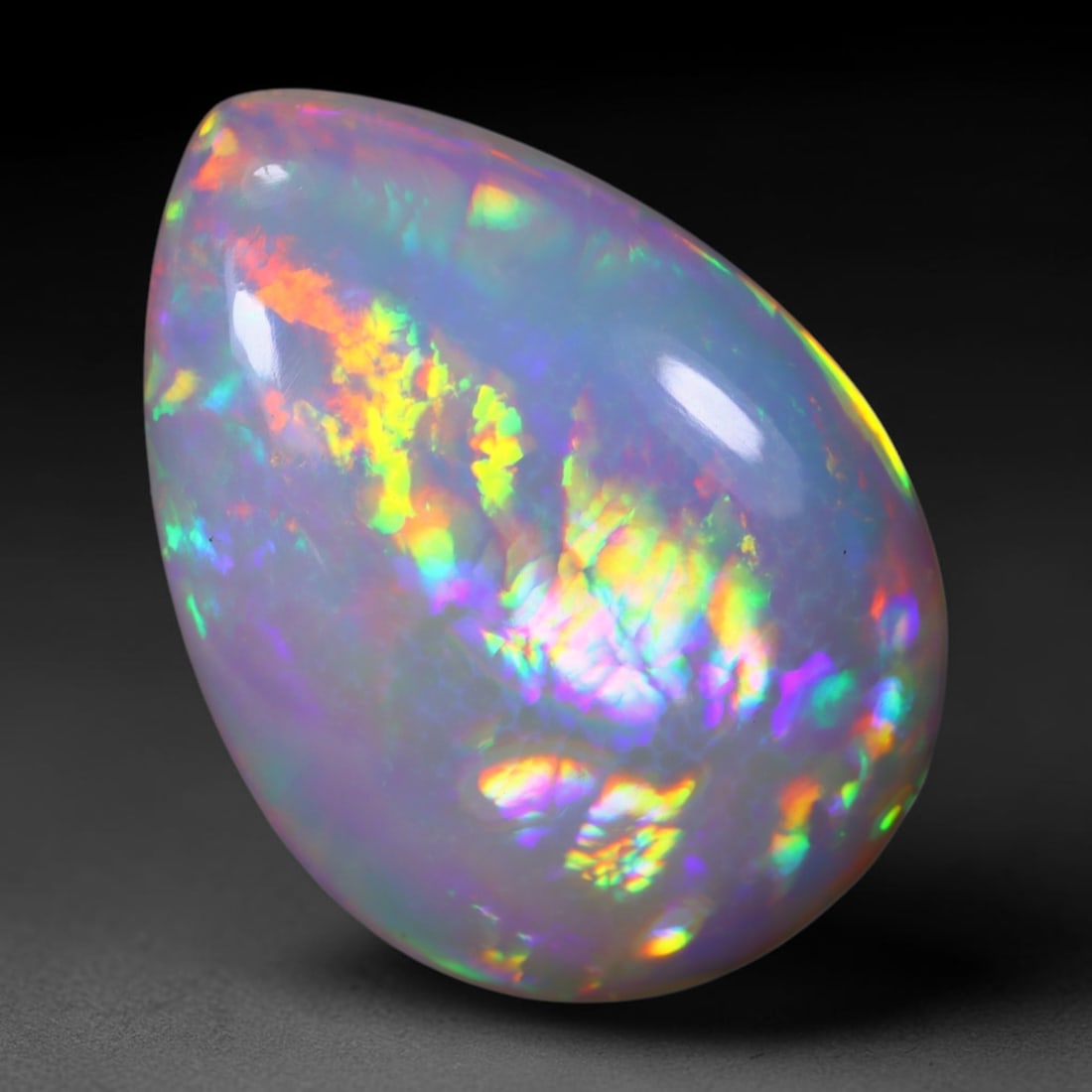 *22.16Ct Welo Opal Polished - Ethiopian Opal , 1136E: Ksmith Heritage Auctioneers Subject: Natural Ethiopian Welo Opal Origin: Ethiopia Carat Weight: 22.26Ct Dimension: 29.2x21x7.9 mm Treatment: Natural Untreated Type: Caboch