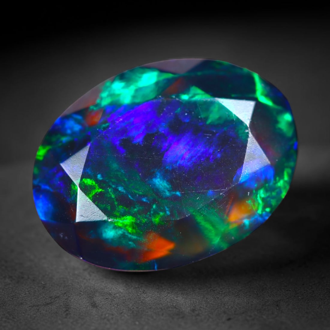 2.08Ct Natural Smoked Ethiopian Black Opal, Faceted Cut - 10.9x8.2x4.8 mm , 695C: Ksmith Heritage Auctioneers Subject: Natural Ethiopian Welo Opal Origin: Ethiopia Treatment: Smoked